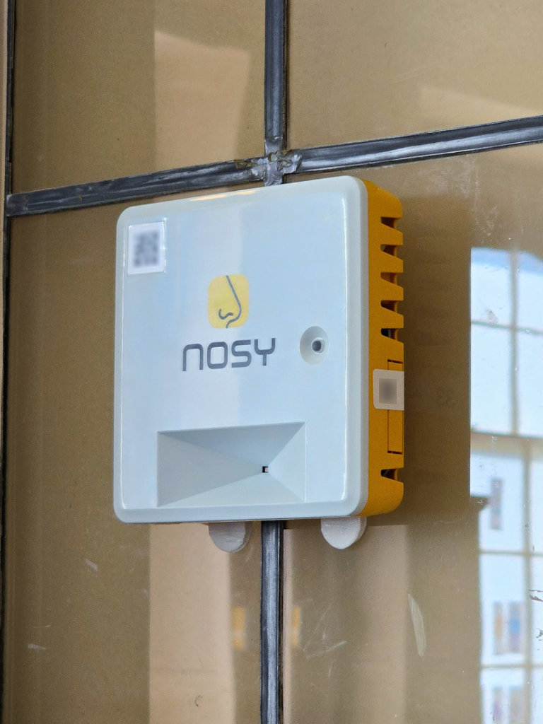 A Nosy™ sensor mounted next to a storage cupboard